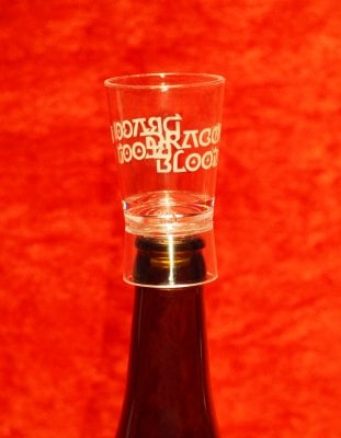 Dragon Blood shot glass to a bottle